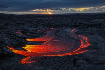 Lava foreground supplemented with a sunrise background